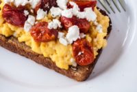Velvety Scrambled Eggs with Sun-Kissed Tomatoes and Creamy Goat Cheese