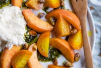 Summer’s Blush Burrata: Roasted Beet, Peach, Basil Oil & Candied Pistachios