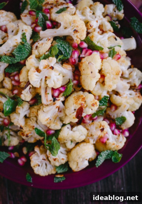 Roasted Cauliflower with Pomegranate Gems, Fresh Mint, and Toasted Almond Crunch 1 featured 16728