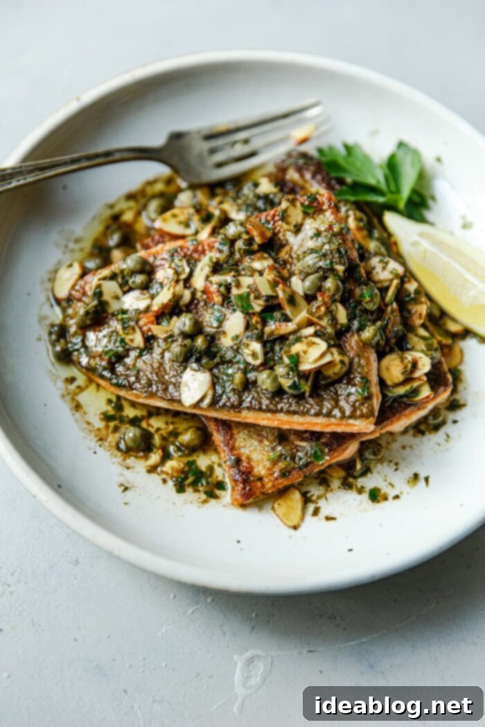 Almond-Kissed Trout 2 Trout Almondine - Pan-seared trout with brown butter, almonds, capers, parsley, and lemon sauce.