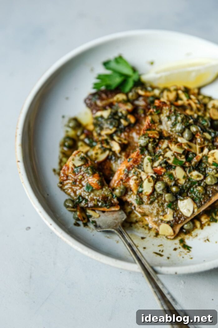 Almond-Kissed Trout 6 Plated Trout Almondine with fresh lemon and parsley
