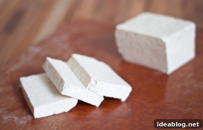 Korean Tofu: A Savory Simmer 5 Firm tofu block, ready to be sliced and prepared for Dubu Jorim.