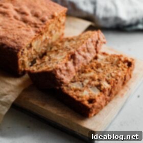 Apple Cinnamon Oat Loaf 12 Sliced Apple Quick Bread on Cutting Board