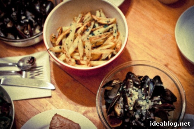 Quintessential Moules Frites 7 A bowl of classic Moules Frites with a side of homemade fries