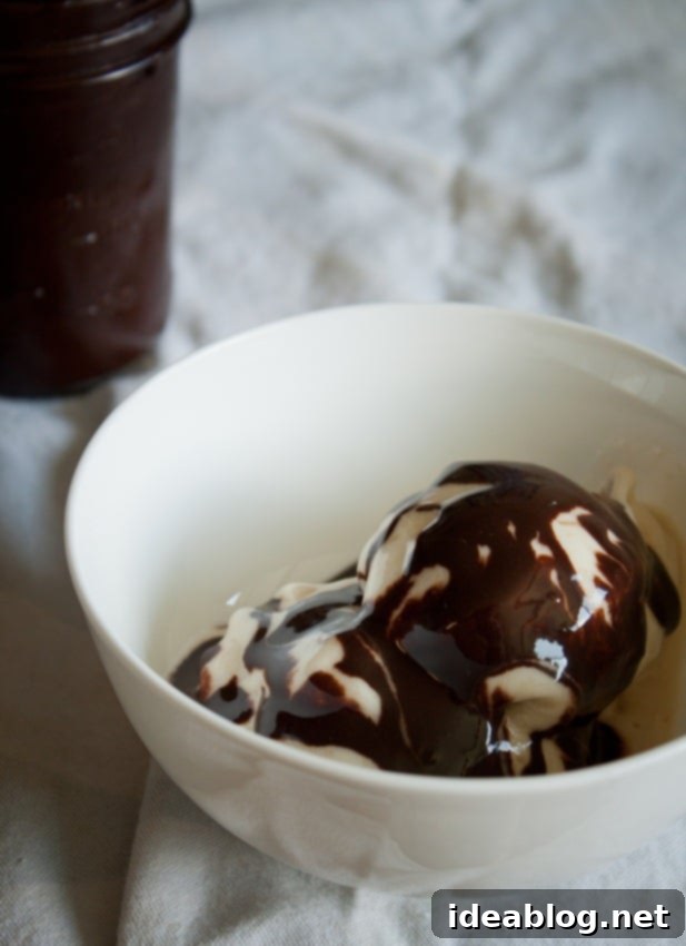 Wintermint Chocolate Elixir 2 Rich Homemade Chocolate Peppermint Syrup in a clear glass jar, ready to be enjoyed.