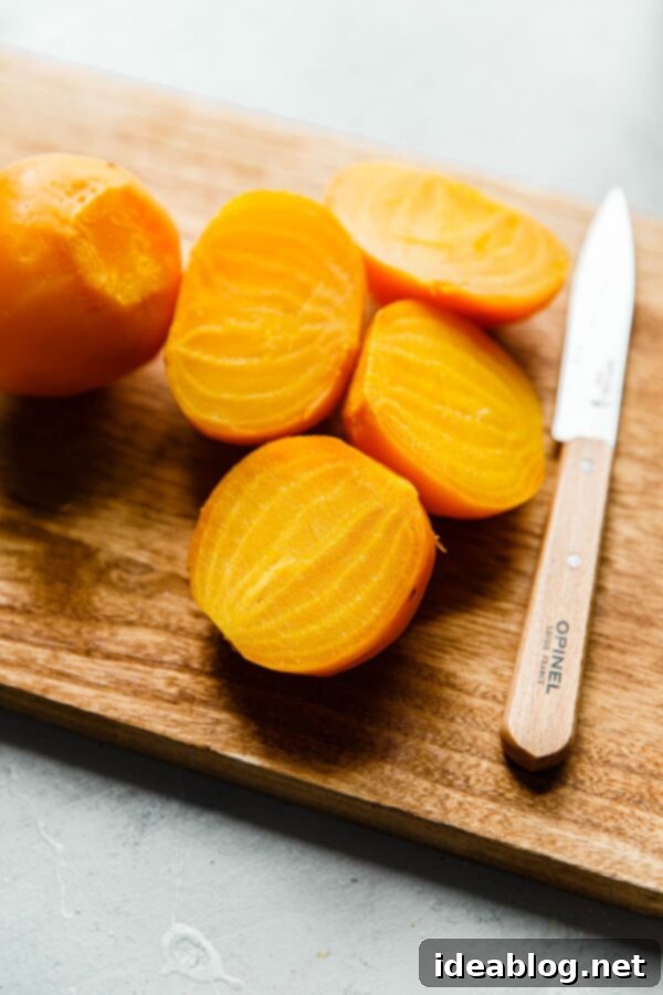 How to Cook Beets: Simple Tutorial for Perfect Results - #beets #vegetables #vegan #glutenfree #easyrecipe Cooked Yellow Beets on Cutting Board