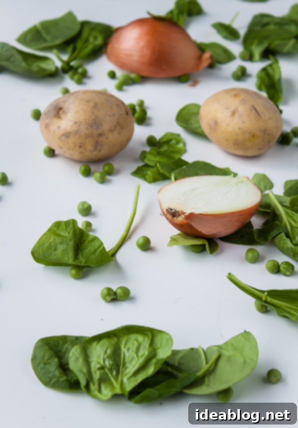 Garden Fresh Spinach Soup with Minted Peas and Cilantro 3 Fresh Spinach soup Ingredients laid out on a table
