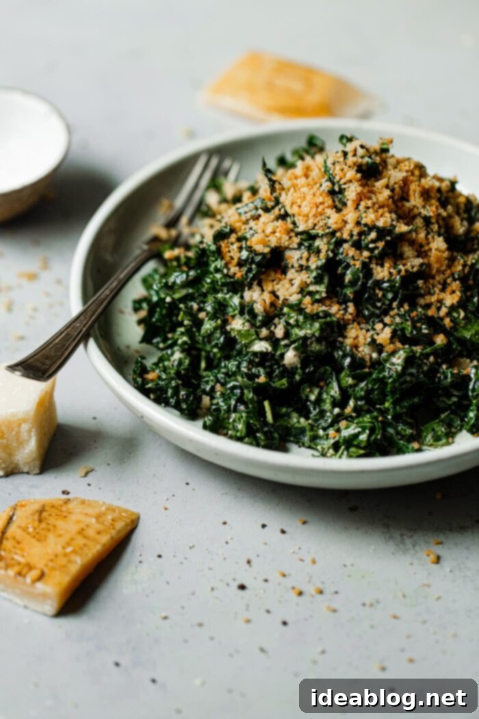 Vibrant Kale Caesar 11 Bowl of Kale Being Tossed with Creamy Caesar Dressing for even coating