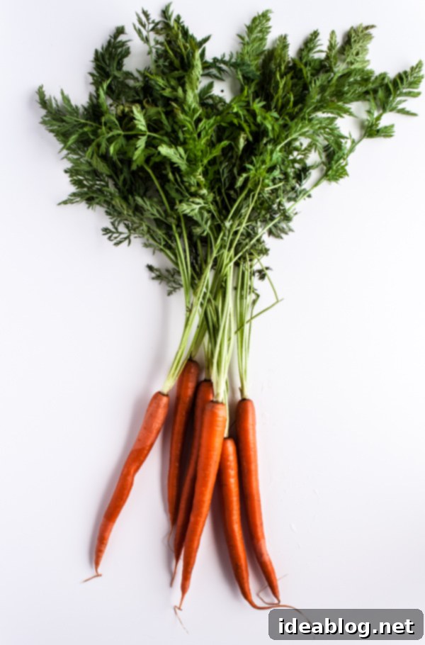 Golden Carrot Salad with Zesty Coriander Vinaigrette and Pistachio Crunch 3 Fresh Carrots with Greens