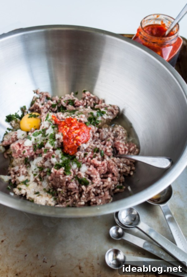 Fiery Harissa Lamb Meatballs with Cool Feta 3 Harissa Lamb Meatball Mixture in a mixing bowl before forming