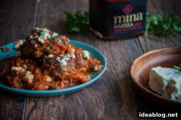 Fiery Harissa Lamb Meatballs with Cool Feta 6 Spicy Harissa Lamb Meatballs with Feta, close up served in a dish