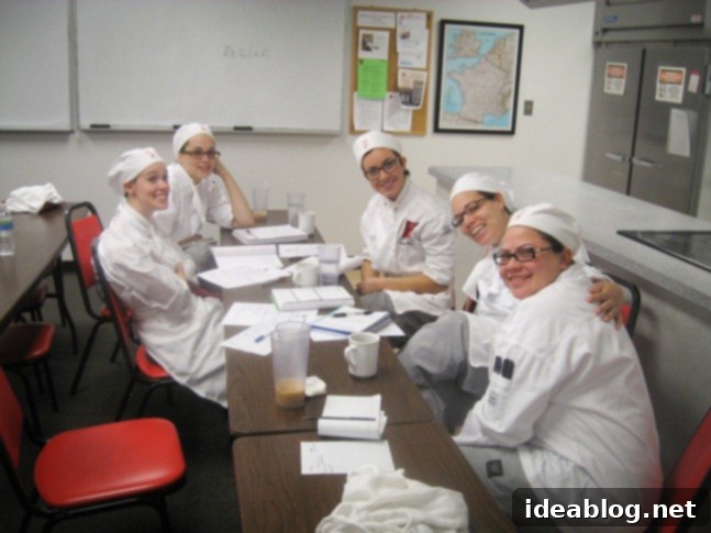 The Six-Course Culinary Challenge 3 Culinary students reviewing menu plans for tasting menu challenge at L'Academie