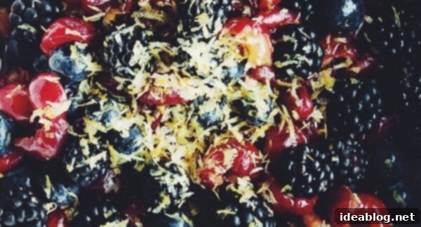Sour Cherry Crisp with Mixed Berries - this delicious sour cherry crisp recipe is made with a combination of fresh sour cherries, blackberries, and blueberries. Topped with an rolled oat crisp topping, it tastes fantastic served warm with vanilla ice cream! #sourcherry #recipe #crisp #abeautifulplate #dessert Sour Cherry Crisp Filling