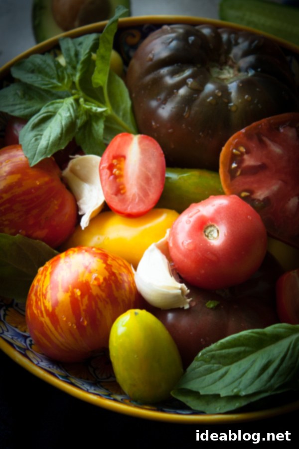 Velvety Heirloom Tomato and Avocado Gazpacho 5 Ingredients for Creamy Heirloom Tomato and Avocado Gazpacho, including fresh basil, avocado, and garlic