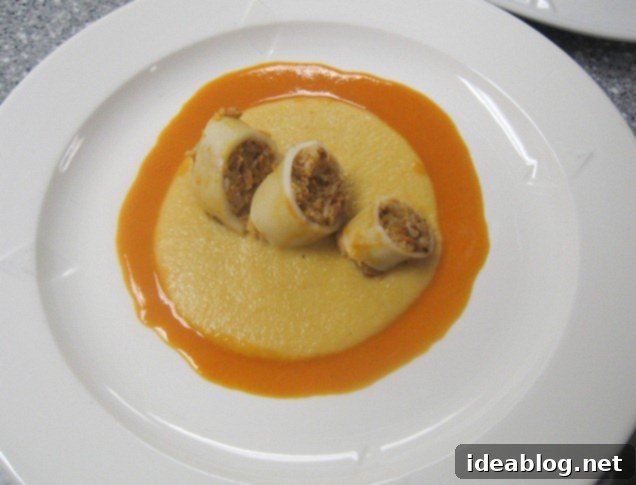 Day 82 Featuring Braised Calamari Moussaka and Gateau Lion D'Or 3 Braised calamari served with polenta and tomato sauce