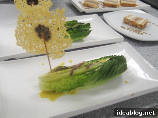 Day 82 Featuring Braised Calamari Moussaka and Gateau Lion D'Or 4 Grilled Caesar salad with parmesan lollipops and anchovies