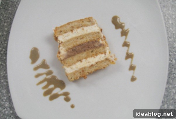 Day 82 Featuring Braised Calamari Moussaka and Gateau Lion D'Or 6 Gateau Lion D'Or, a multi-layered dessert with candied nuts