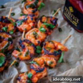 Fiery Harissa Shrimp Skewers with Zesty Basil Oil 8 Grilled Harissa Shrimp Skewers with Basil Oil