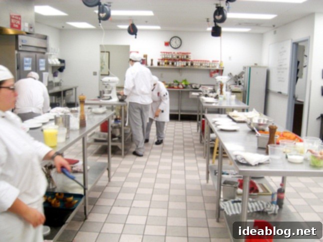 Day 79 and 80: Tuna Tartare, Frog Legs, Veal Cheeks, and Apple Tart 4 Culinary school students working in a professional kitchen