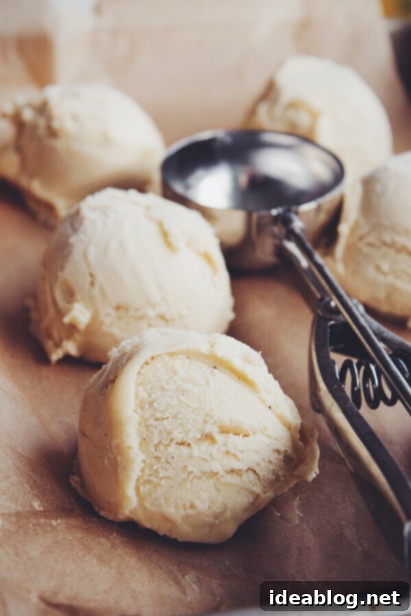 Golden Banana Bliss 2 Lush scoop of Brown Butter Banana Ice Cream with vanilla bean flecks in a bowl