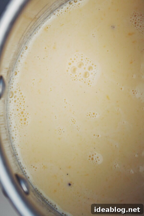 Golden Banana Bliss 3 Creamy Brown Butter Banana Ice Cream base chilling in a glass container