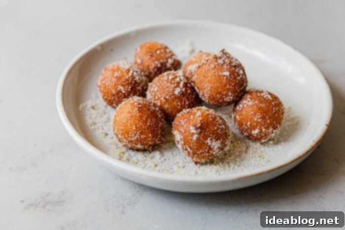 Lemon Cardamom Ricotta Donuts 12 Ricotta Donut Holes generously coated in lemon cardamom sugar, ready to be served.