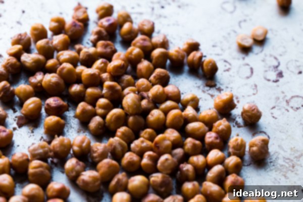 Salt and Vinegar Roasted Chickpeas. A easy, protein and fiber-packed healthy snack that you won't be able put down! #chickpeas #glutenfree #recipe #snacks #abeautifulplate #recipe Serving Salt and Vinegar Roasted Chickpeas