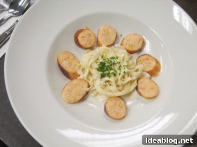 Day 60: Hearty Sausage, Classic Basquaise Chicken, and Rich Chocolate Mousse 3 Plated seafood sausage with homemade pasta, cream sauce, and fresh herbs