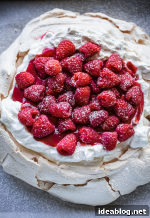 Berry Burst Pavlova with Vanilla Whipped Cream 5 Raspberry Pavlova with Vanilla Whipped Cream