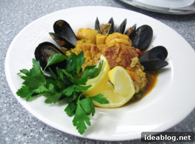 Day 55: Steak Tartare, Paella, & Souffle 3 Delicious seafood and chicken paella served hot