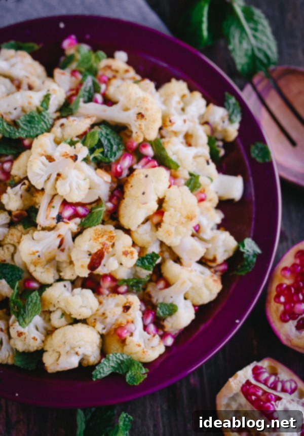 Roasted Cauliflower with Pomegranate Gems, Fresh Mint, and Toasted Almond Crunch 2 Roasted Cauliflower with Pomegranate Arils, Mint, and Toasted Almonds