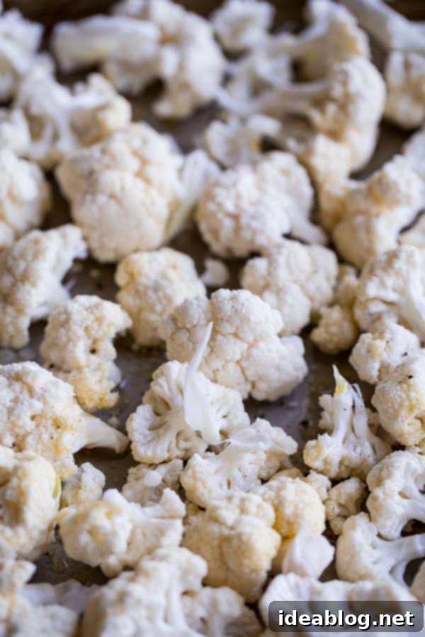 Roasted Cauliflower with Pomegranate Gems, Fresh Mint, and Toasted Almond Crunch 5 Cauliflower Florets
