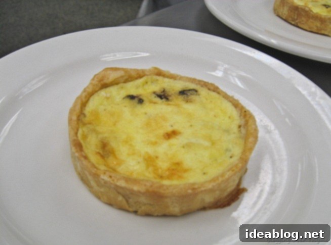 A Trio of French Delights: Chicken Roulade, Pommes Duchesse, and Marjolaine 4 Classic Quiche Lorraine with golden crust