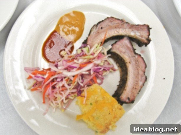 Day 42: A Culinary Journey of Savory and Sweet 2 BBQ food spread including ribs, coleslaw, and cornbread