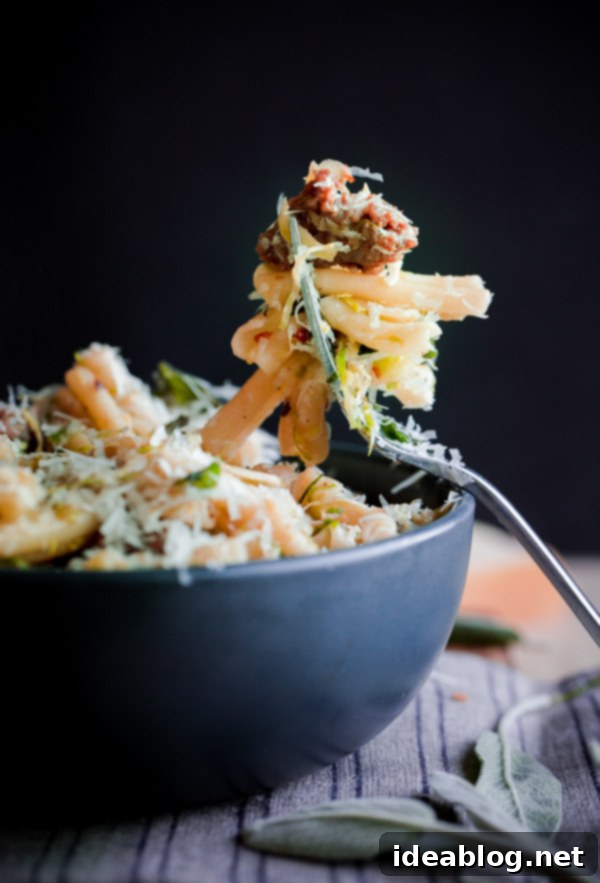 Strozzapreti with Pork Sausage, Crisp Brussels, and Fresh Sage 6 A close-up of the prepared Strozzapreti pasta dish, ready to be served