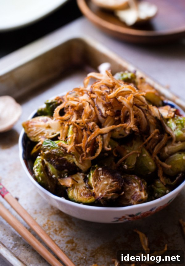 Savory Asian Brussels Sprouts with Crispy Shiitake 6 A close-up shot of the finished Asian Roasted Brussels Sprouts with Crispy Fried Shiitake Mushrooms in a serving bowl, ready to enjoy.