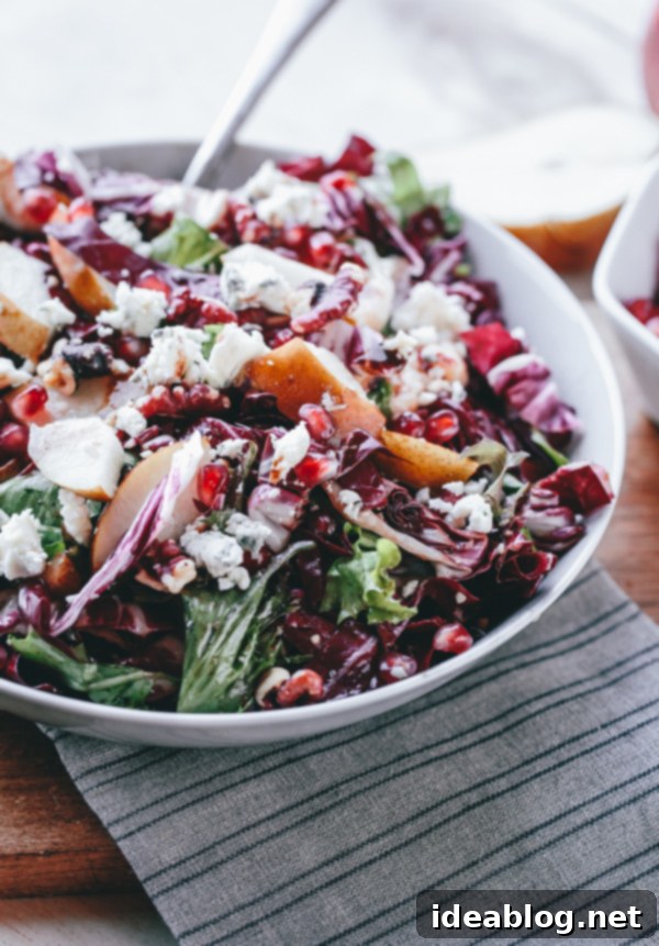 Jeweled Radicchio Salad with Pear, Gorgonzola, and Walnuts 2 Vibrant Radicchio, Pear, Gorgonzola, Pomegranate, and Walnut Salad, perfect for holiday gatherings