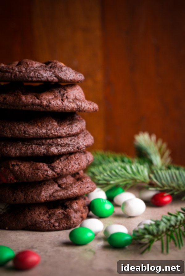 Minty Chocolate Holiday M&M Treats 5 Unbaked M&M Holiday Mint Chocolate Cookie dough balls on a baking sheet