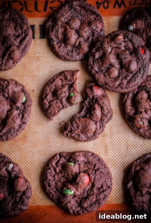 Minty Chocolate Holiday M&M Treats 6 Freshly baked M&M Holiday Mint Chocolate Cookies cooling on a wire rack