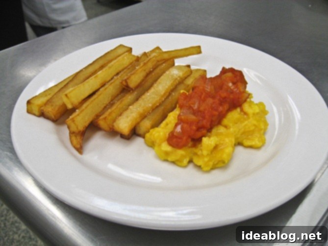 Homemade Comfort: Ravioli, Scrambled Eggs and Brownies 9 Plated French Fries with Scrambled Eggs