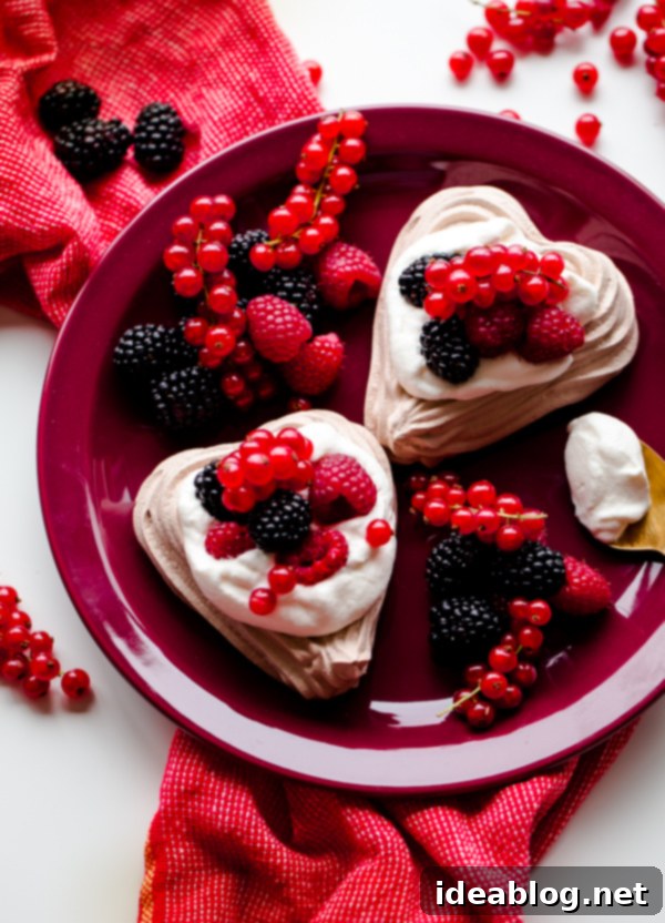 Sweetheart Chocolate Meringue Berry Delights 2 Chocolate Heart Meringue Cups with Whipped Cream and Berries. An elegant, simple dessert for Valentine's Day!