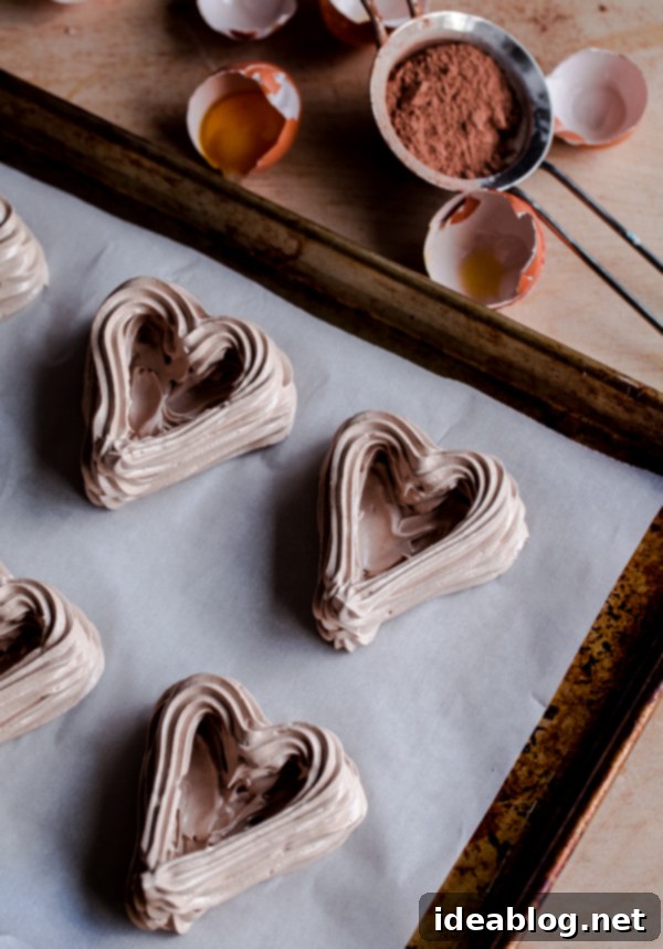 Sweetheart Chocolate Meringue Berry Delights 5 Chocolate Heart Meringue Cups with Whipped Cream and Berries. An elegant, simple dessert for Valentine's Day!