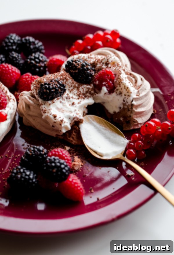 Sweetheart Chocolate Meringue Berry Delights 7 Chocolate Heart Meringue Cups with Whipped Cream and Berries. An elegant, simple dessert for Valentine's Day!