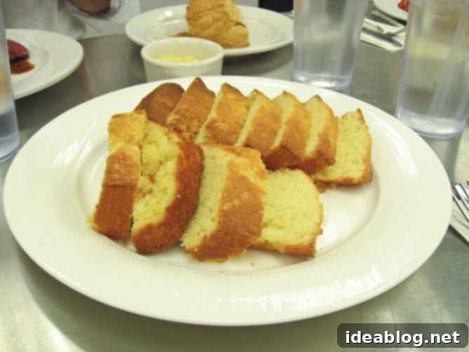 Day 16: French Bistro Delights 13 Two slices of golden-brown pound cake, one with a fork, suggesting a sweet and satisfying dessert.