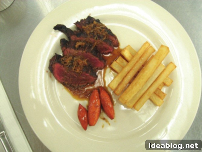 Day 16: French Bistro Delights 3 A perfectly cooked hanger steak with crispy french fries and elegantly turned glazed carrots, a classic French plating.