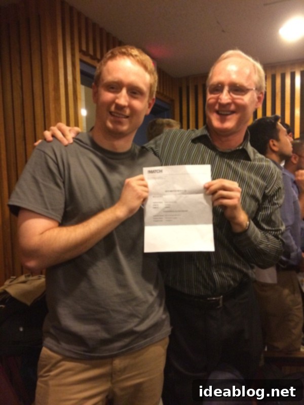 Game-Changing News 4 Connor holding his Match Day envelope with family