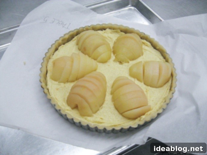 Day Eleven's French Feast: Velvety Veal and Sweet Pear Tart 2 Elegant Poached Pear Tart with Frangipane Filling