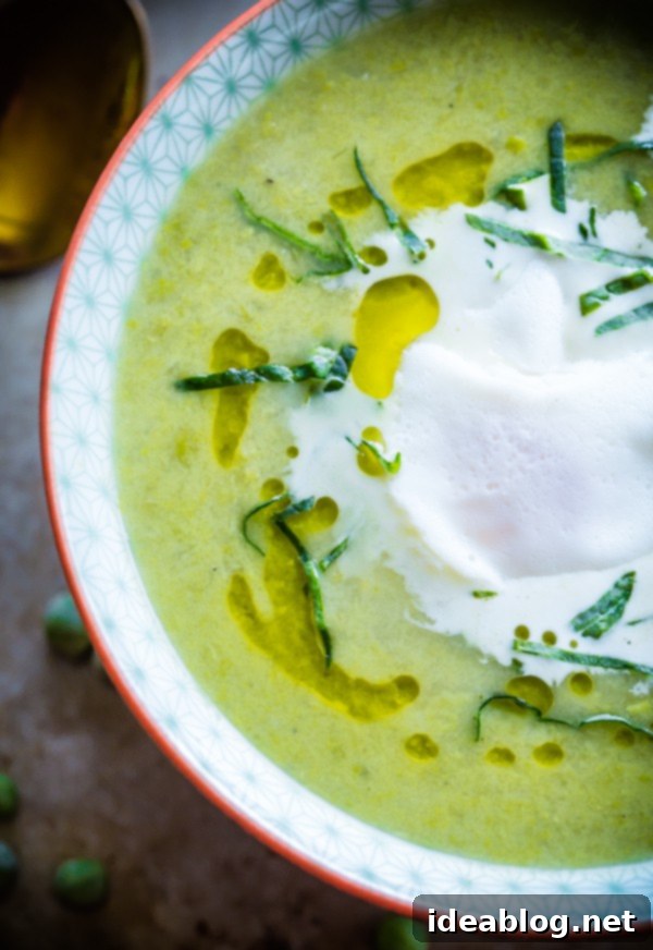 Spring Pea and Leek Soup with Poached Eggs 4 Close-up of Chunky Pea and Leek Soup with a perfectly poached egg and fresh herbs, ready to be served