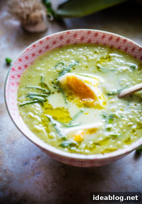 Spring Pea and Leek Soup with Poached Eggs 5 Another view of the Chunky Pea and Leek Soup with Poached Eggs, showcasing the vibrant green and creamy egg yolk