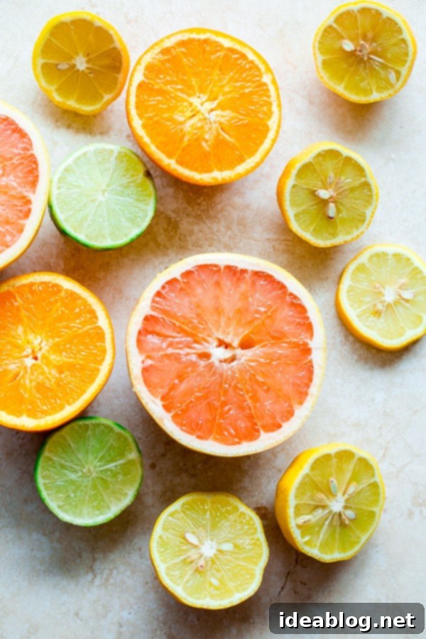 Bright Citrus Coconut Shortbread 3 Assortment of fresh sliced citrus fruits including lemon, lime, orange, and grapefruit, ready for juicing